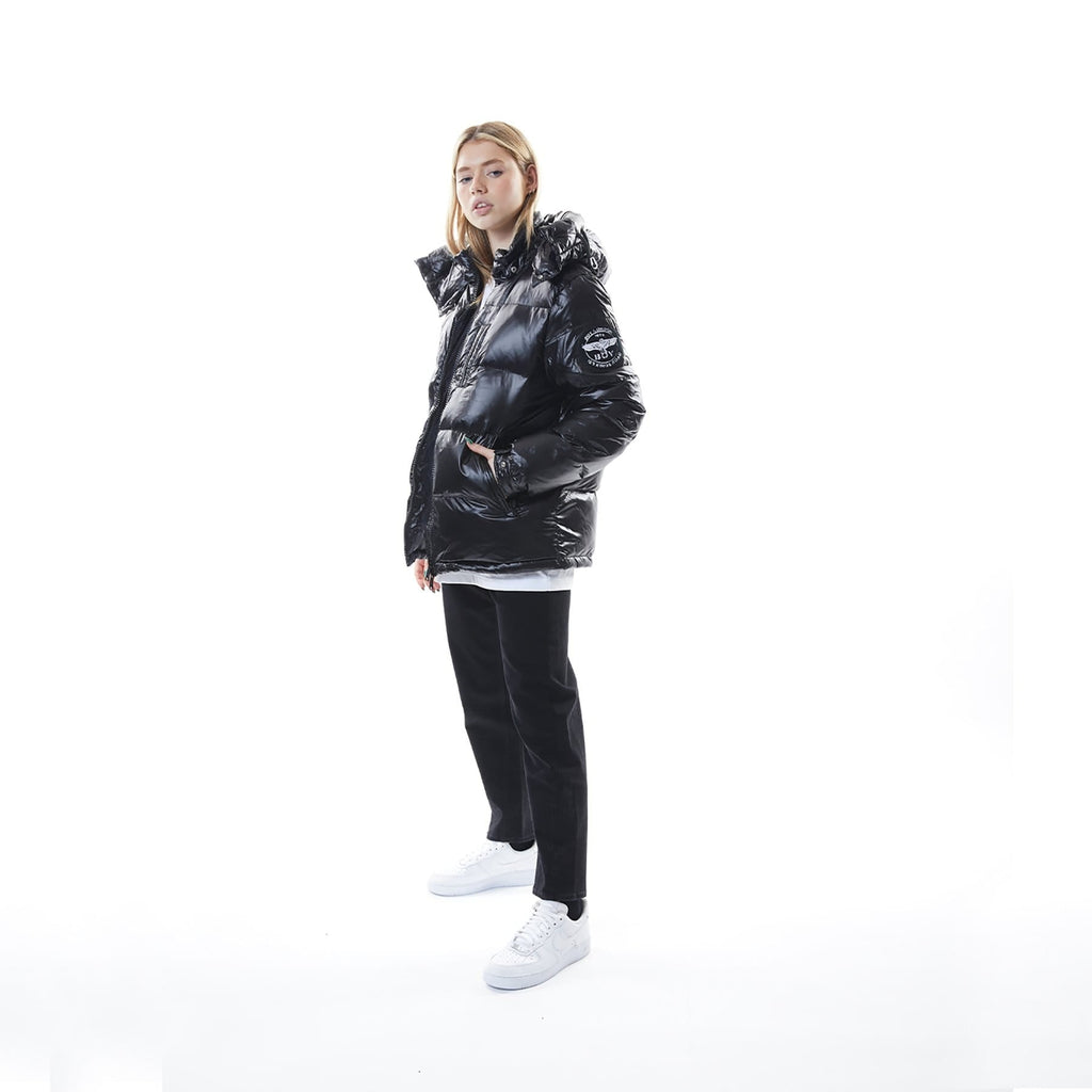 Model wearing Black BOY London puffer jacket with a hood on a white background