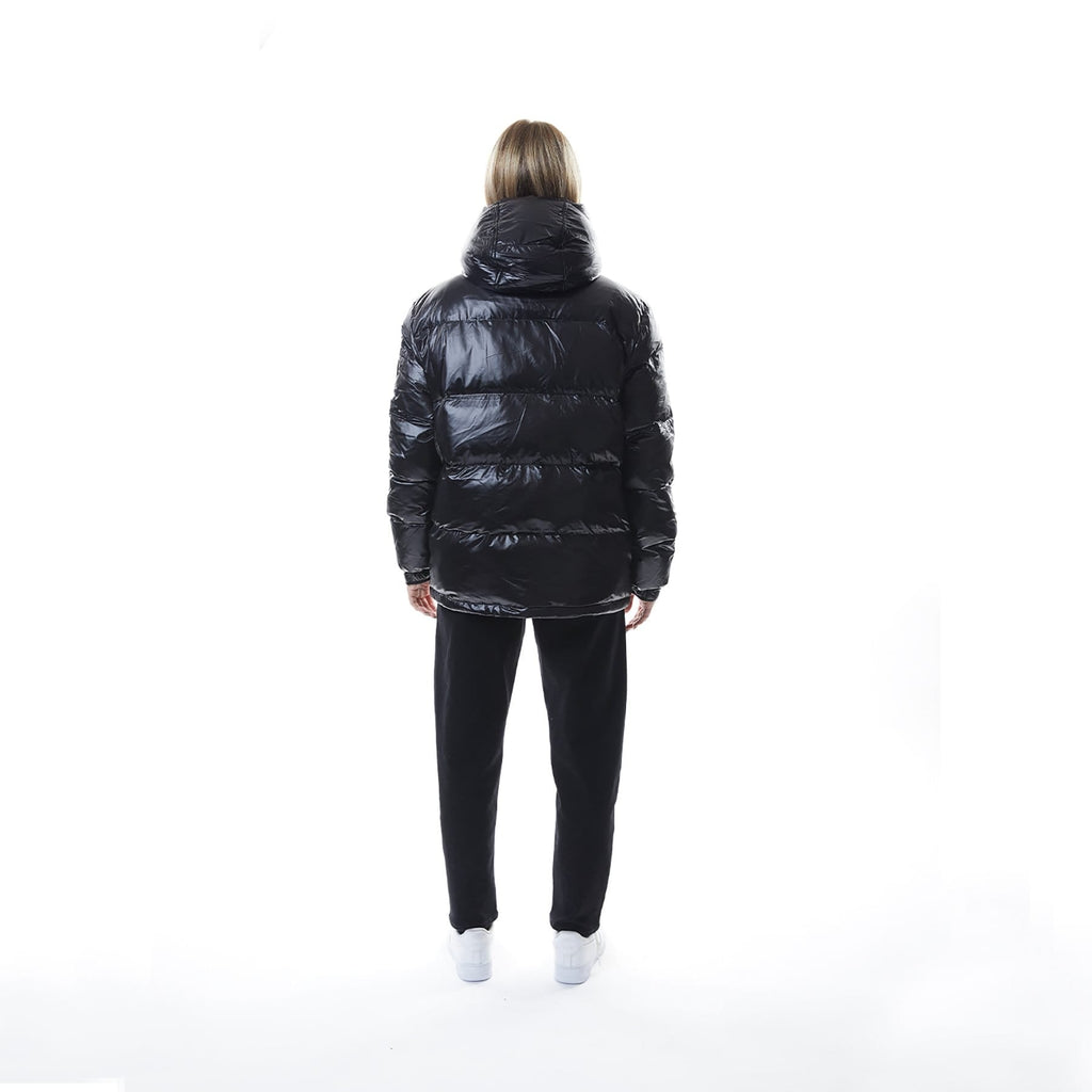 Model wearing Black BOY London puffer jacket with a hood on a white background