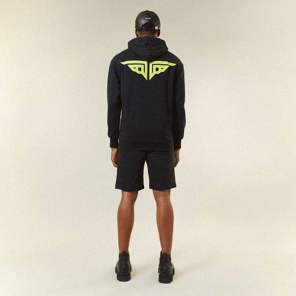 Model BOY London shorts on plain background 