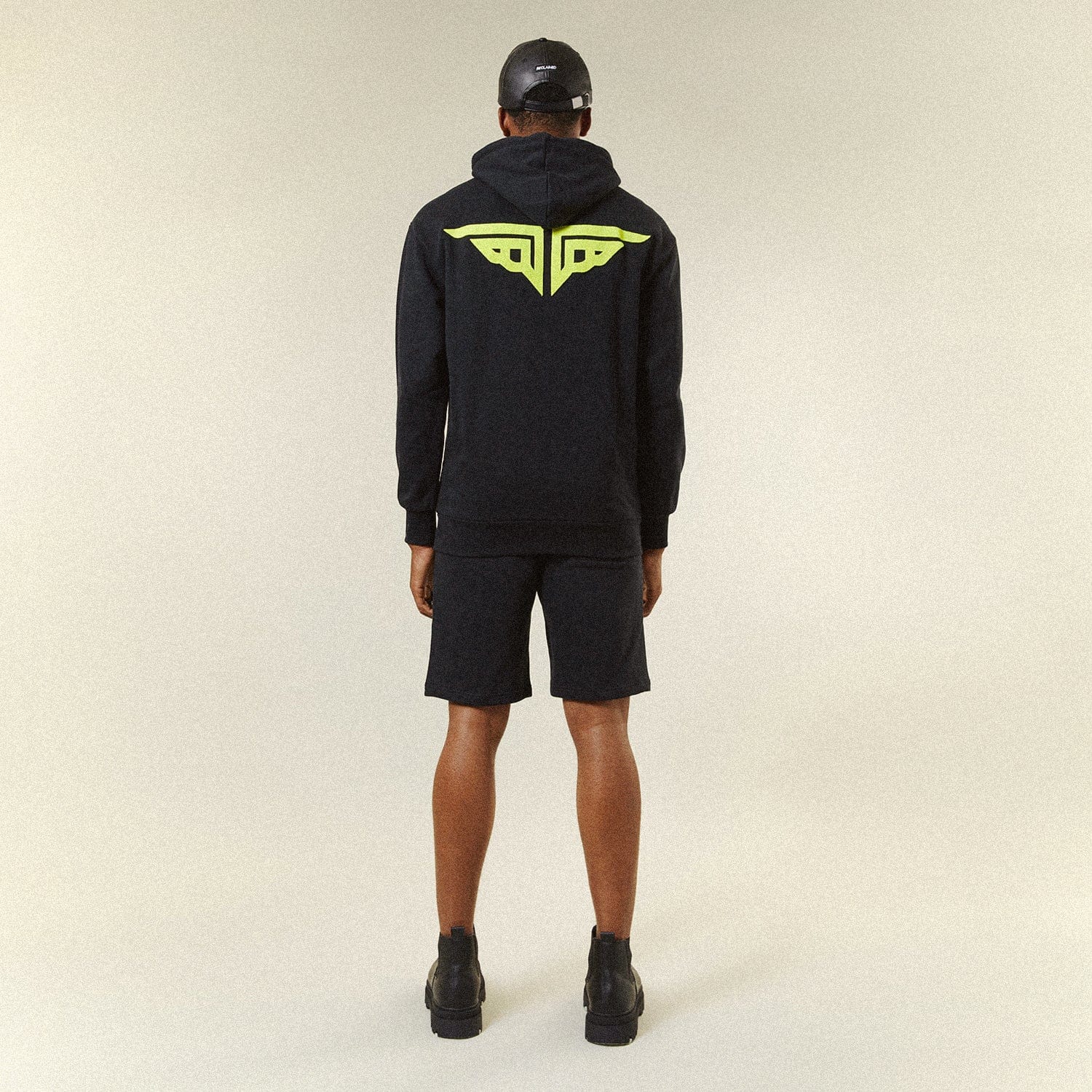 Model BOY London shorts on plain background 
