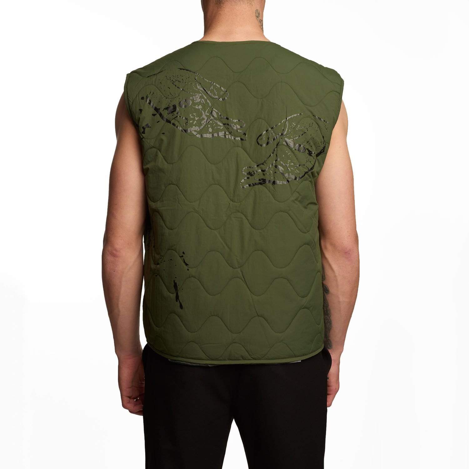 male model wearing Boy London green gilet on white background