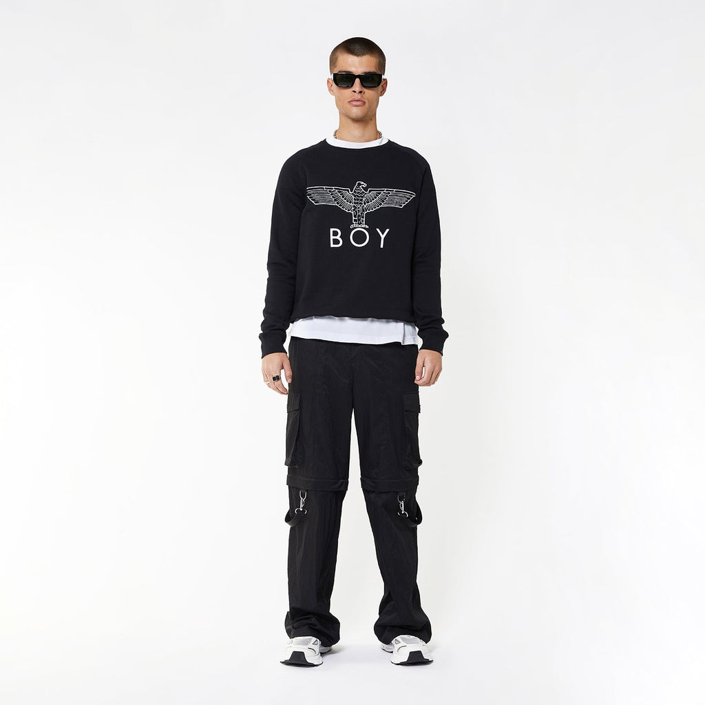 Model wearing BOY London sweatshirt on white background