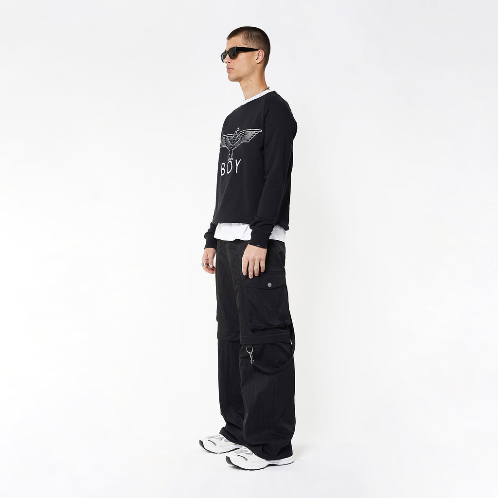 Model wearing BOY London sweatshirt on white background