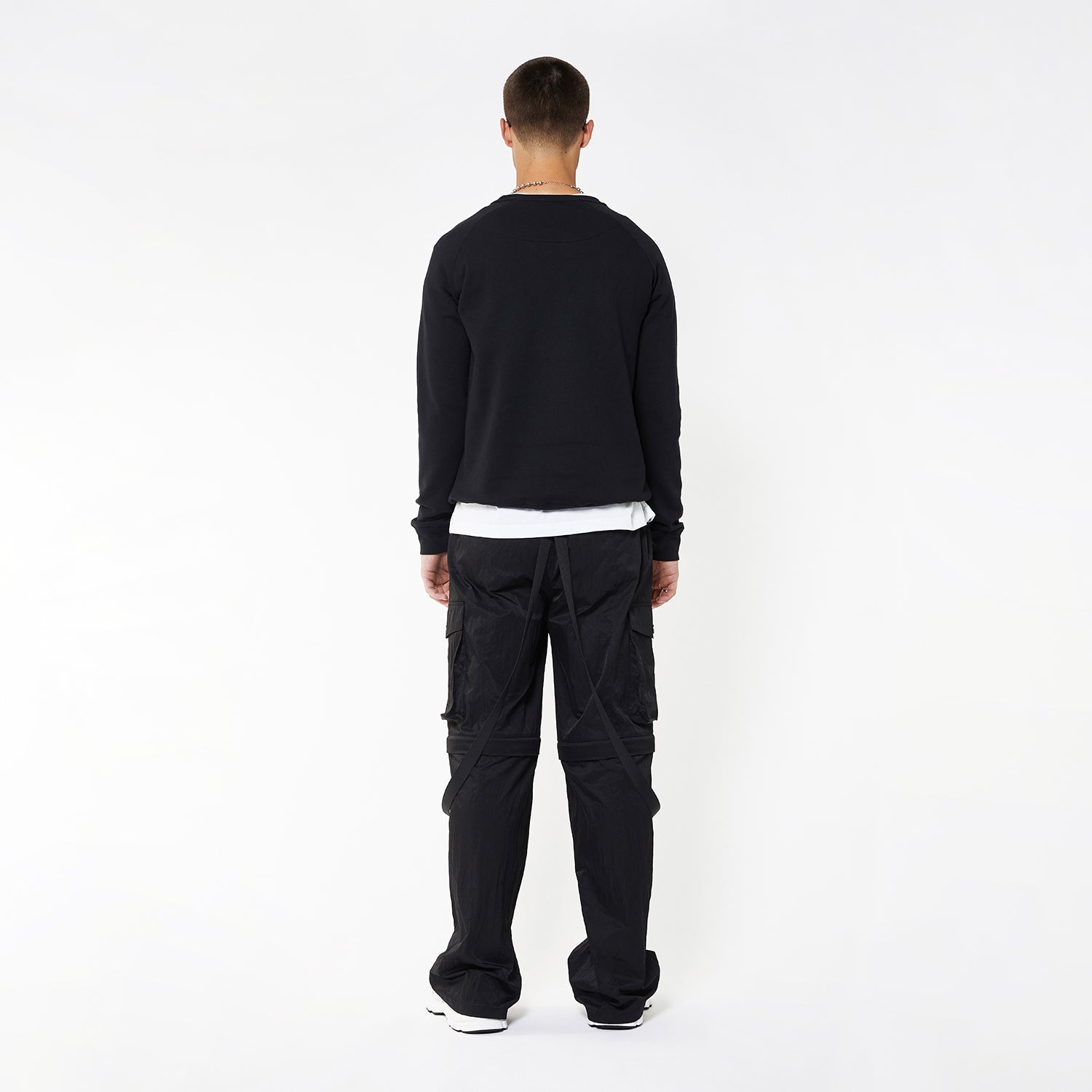 Model wearing BOY London sweatshirt on white background
