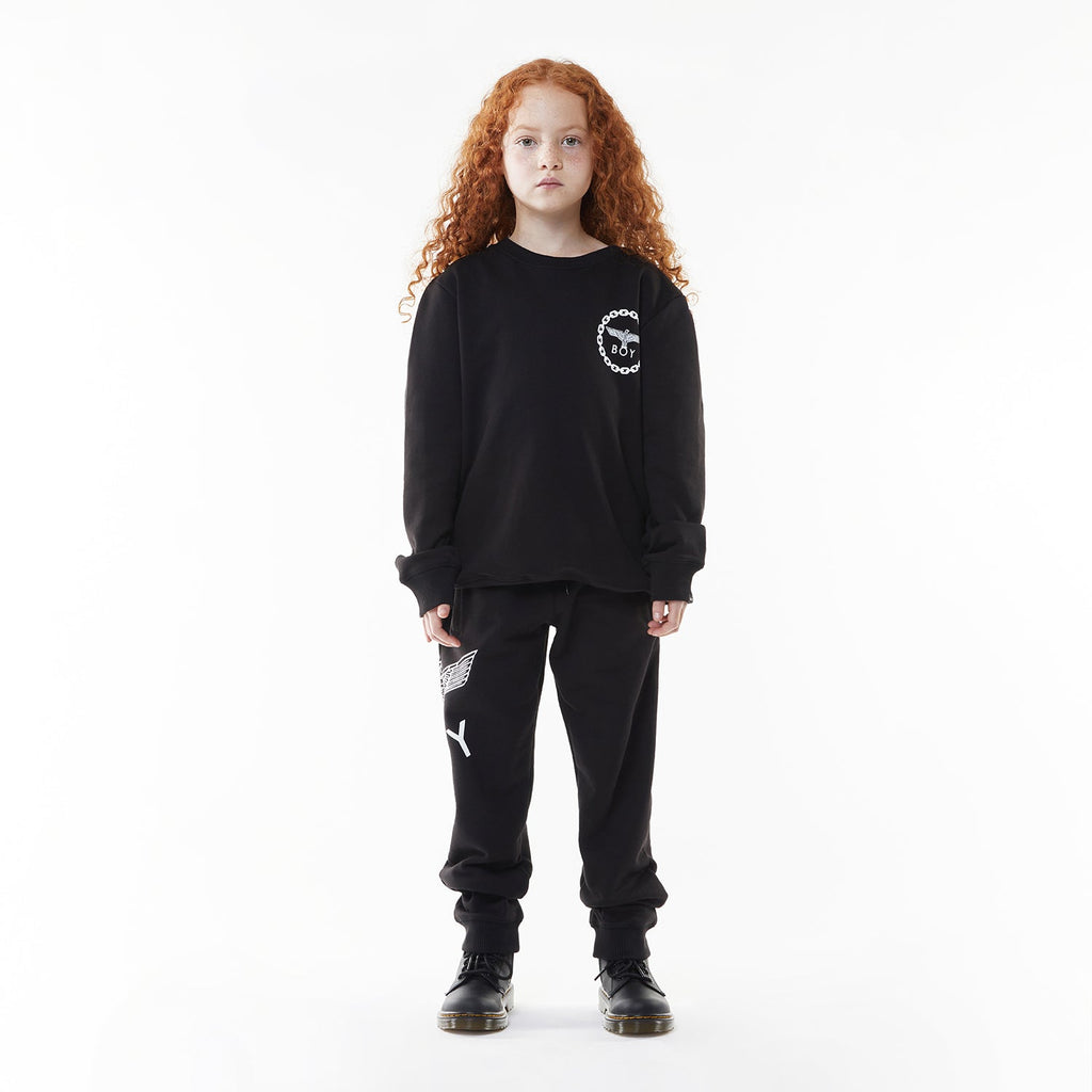 Model wearing BOY London sweatshirt on white background 