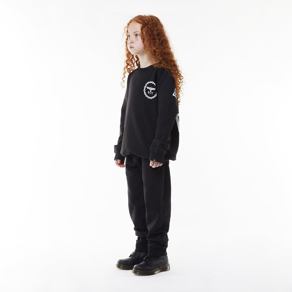 Model wearing BOY London sweatshirt on white background 
