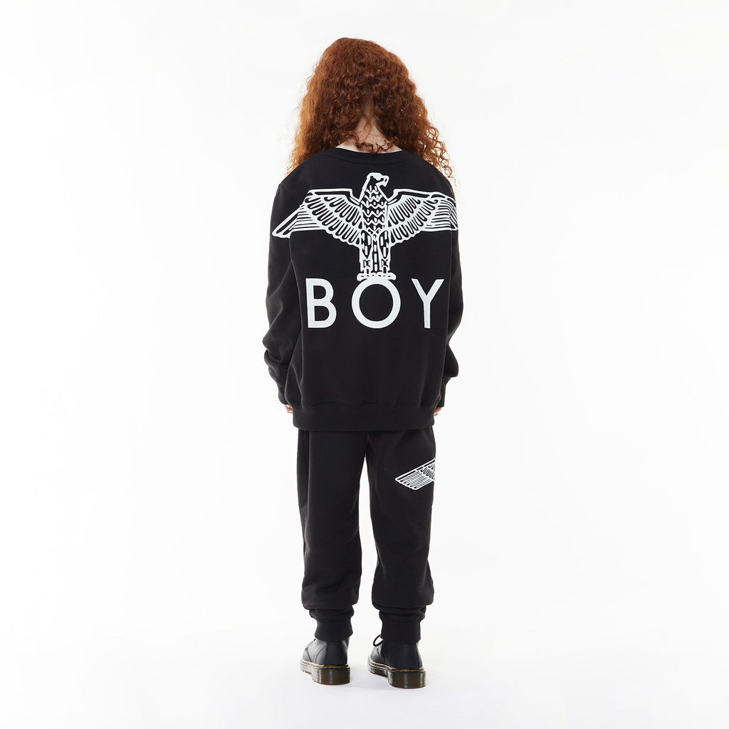 Model wearing BOY London sweatshirt on white background 