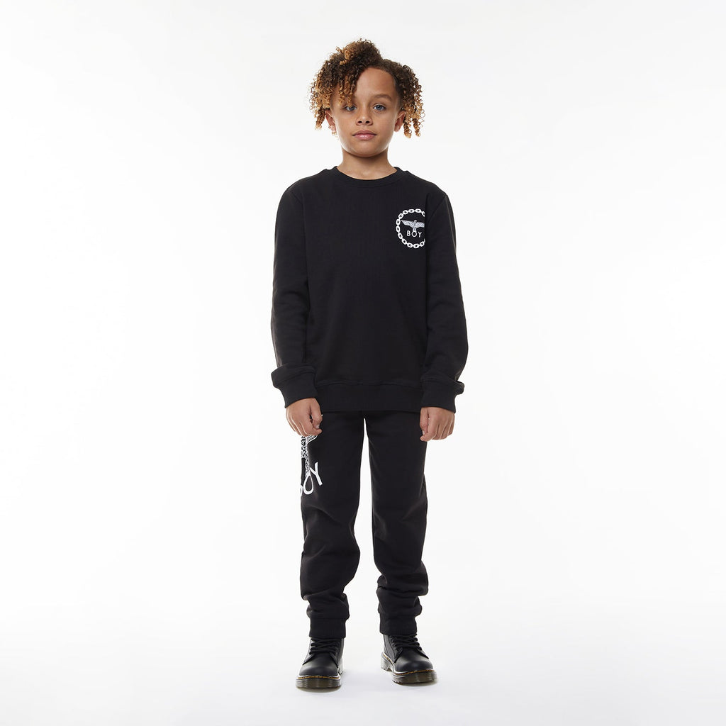 Model wearing BOY London sweatshirt on white background 