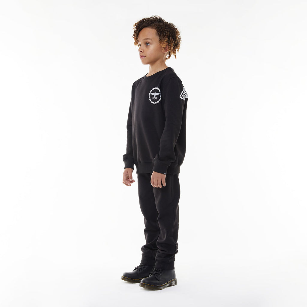Model wearing BOY London sweatshirt on white background 