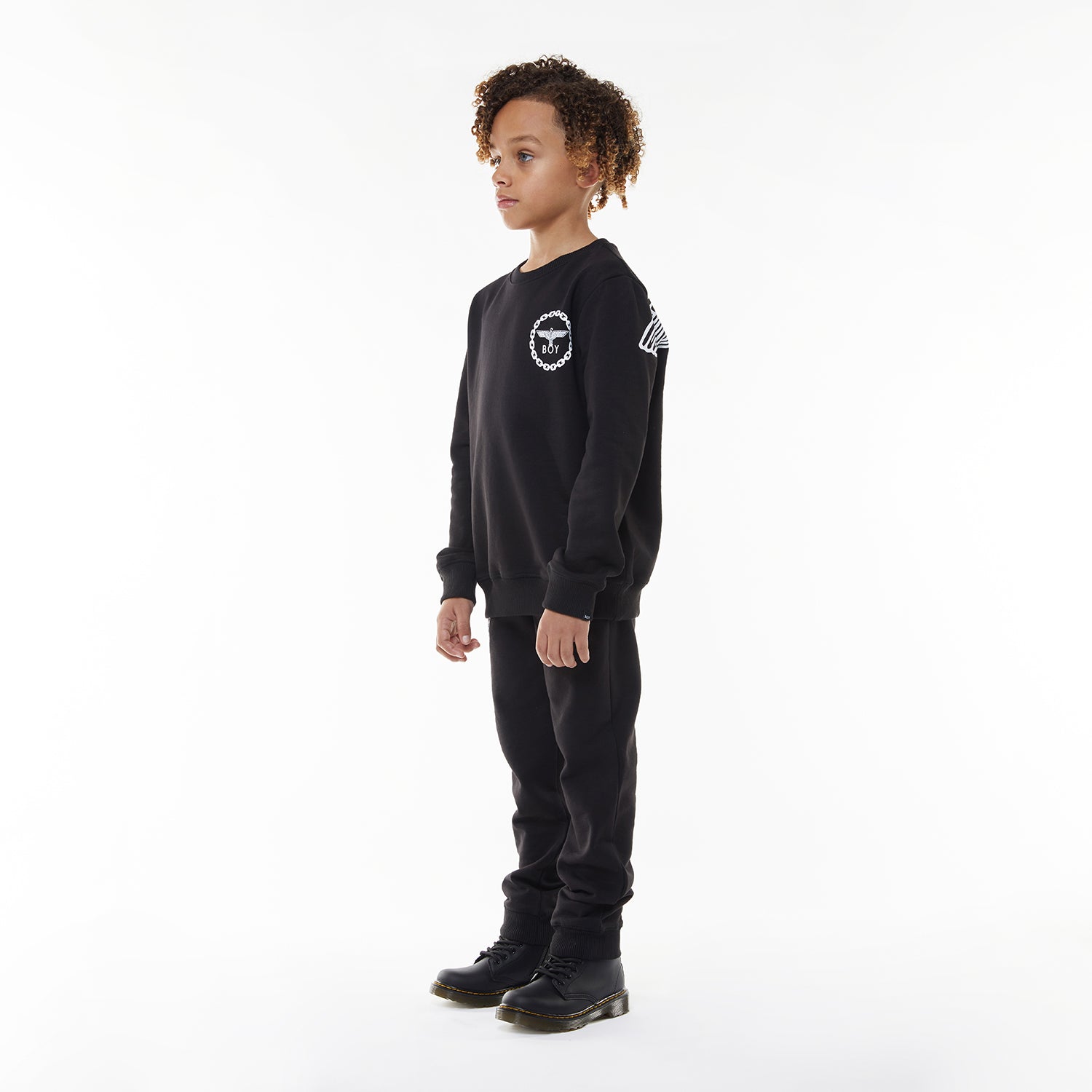 Model wearing BOY London sweatshirt on white background 