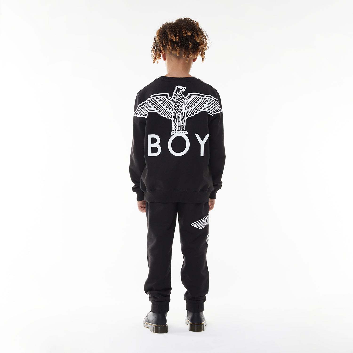 Model wearing BOY London sweatshirt on white background 