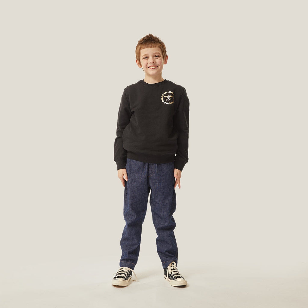 Model wearing BOY London sweatshirt on white background