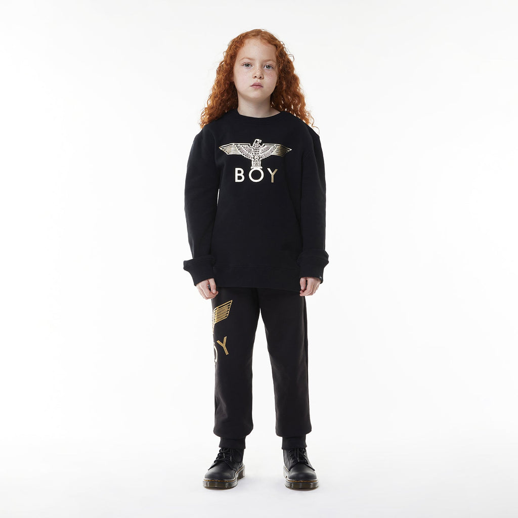 Model wearing Black hoodie with 'BOY' London logo on a white background