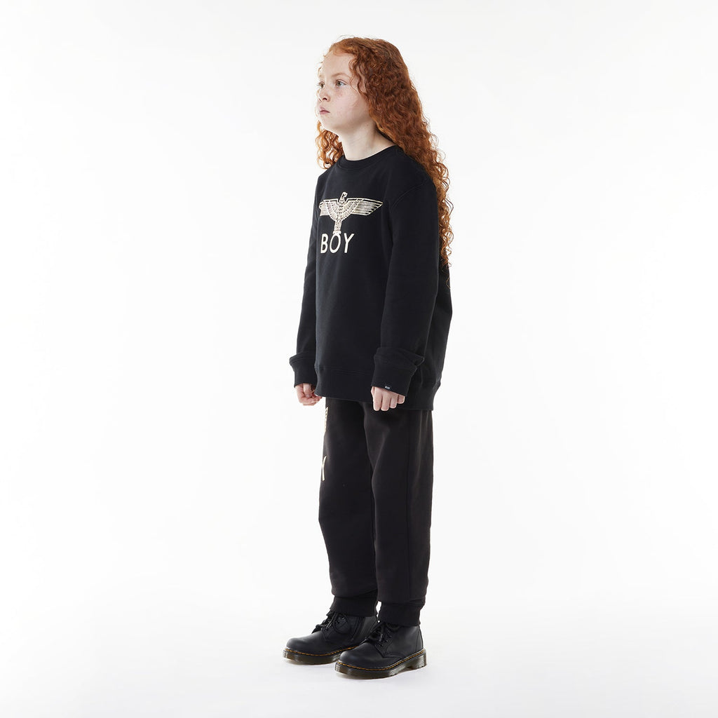 Model wearing Black hoodie with 'BOY' London logo on a white background