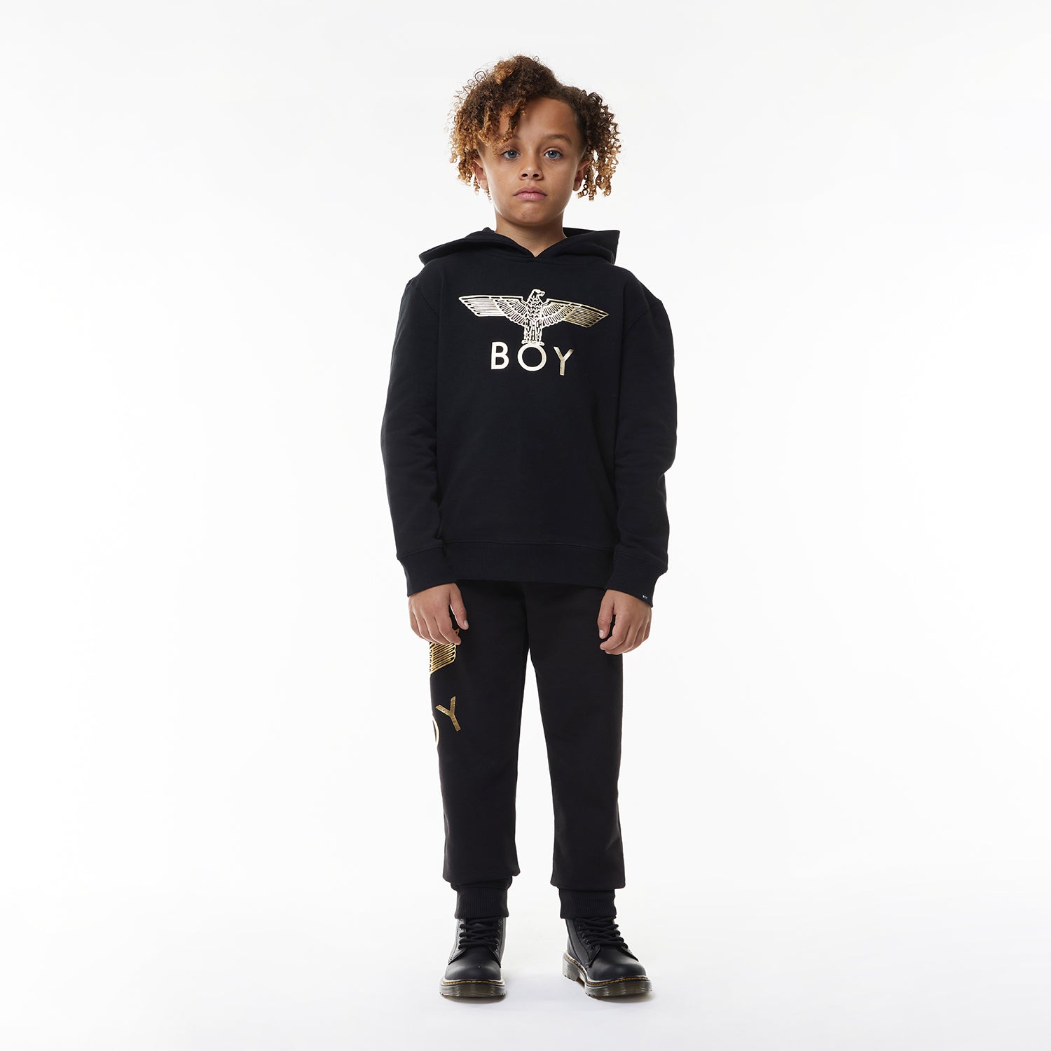 Model wearing Black hoodie with 'BOY' London logo on a white background