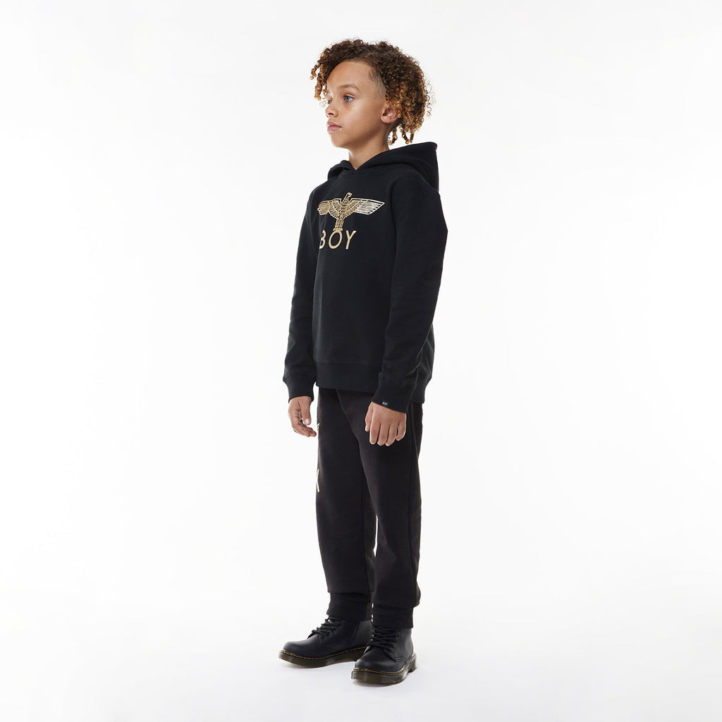 Model wearing Black hoodie with 'BOY' London logo on a white background