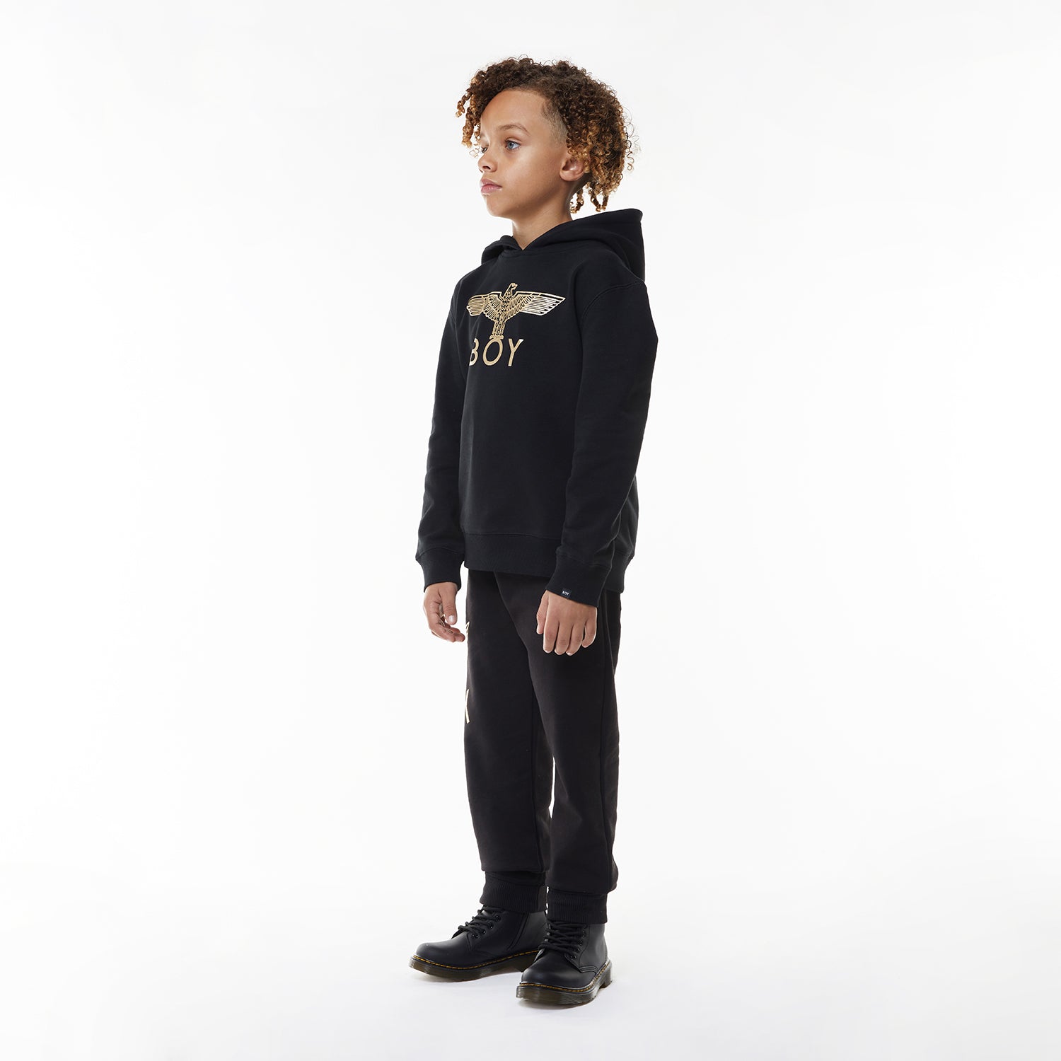 Model wearing Black hoodie with 'BOY' London logo on a white background