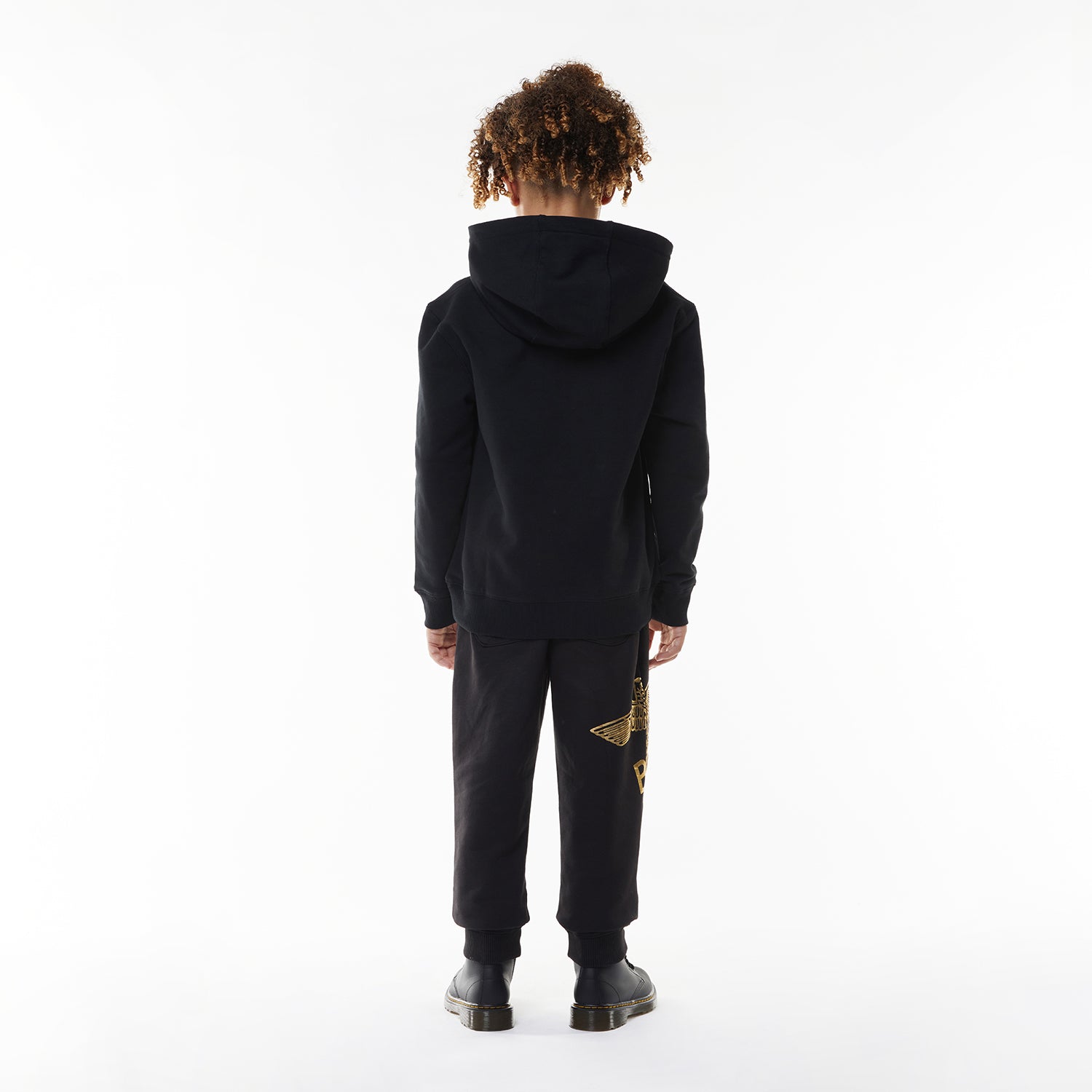 Model wearing Black hoodie with 'BOY' London logo on a white background