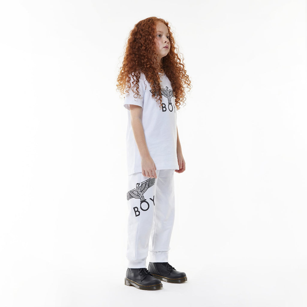 Model wearingWhite sweatpants with a logo on a white background