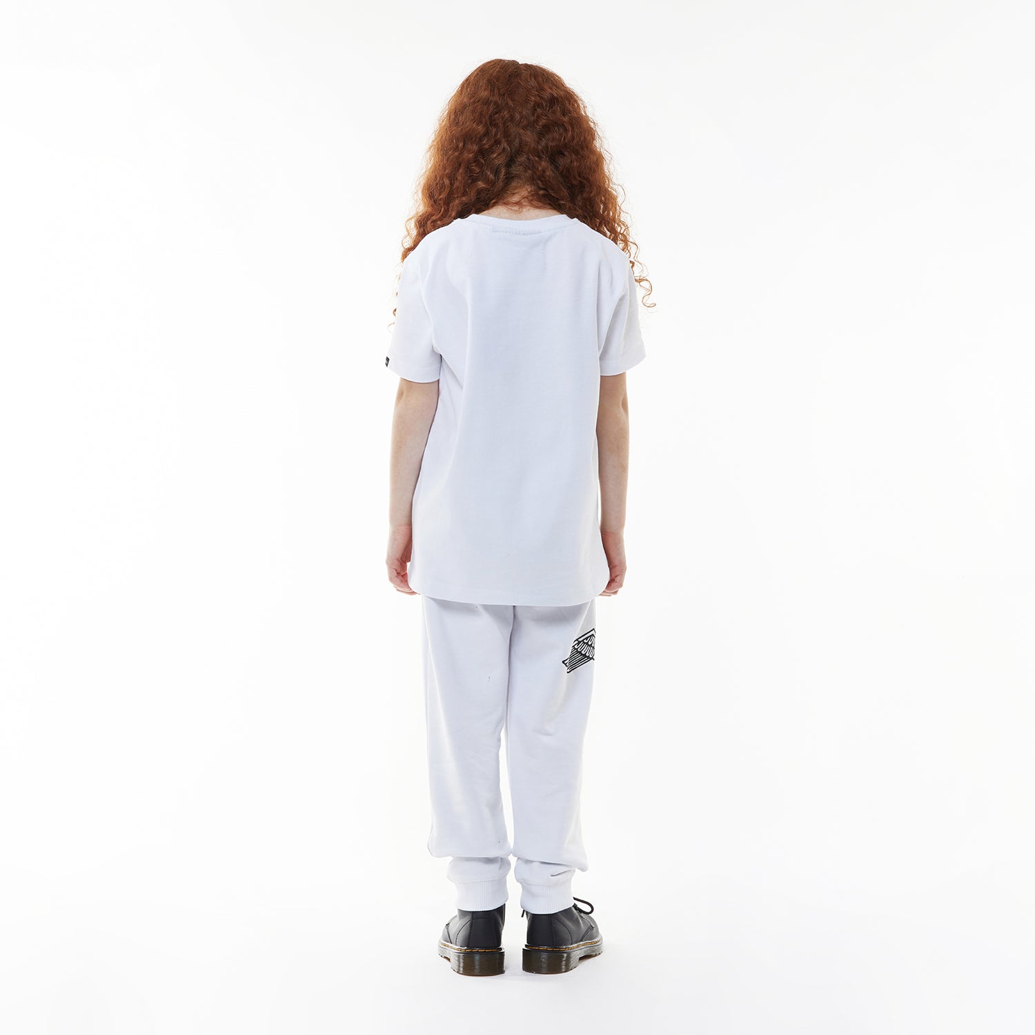 Model wearing White sweatpants with a logo on a white background