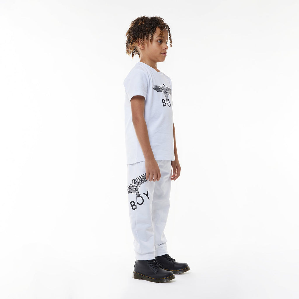 Model wearing White sweatpants with a logo on a white background