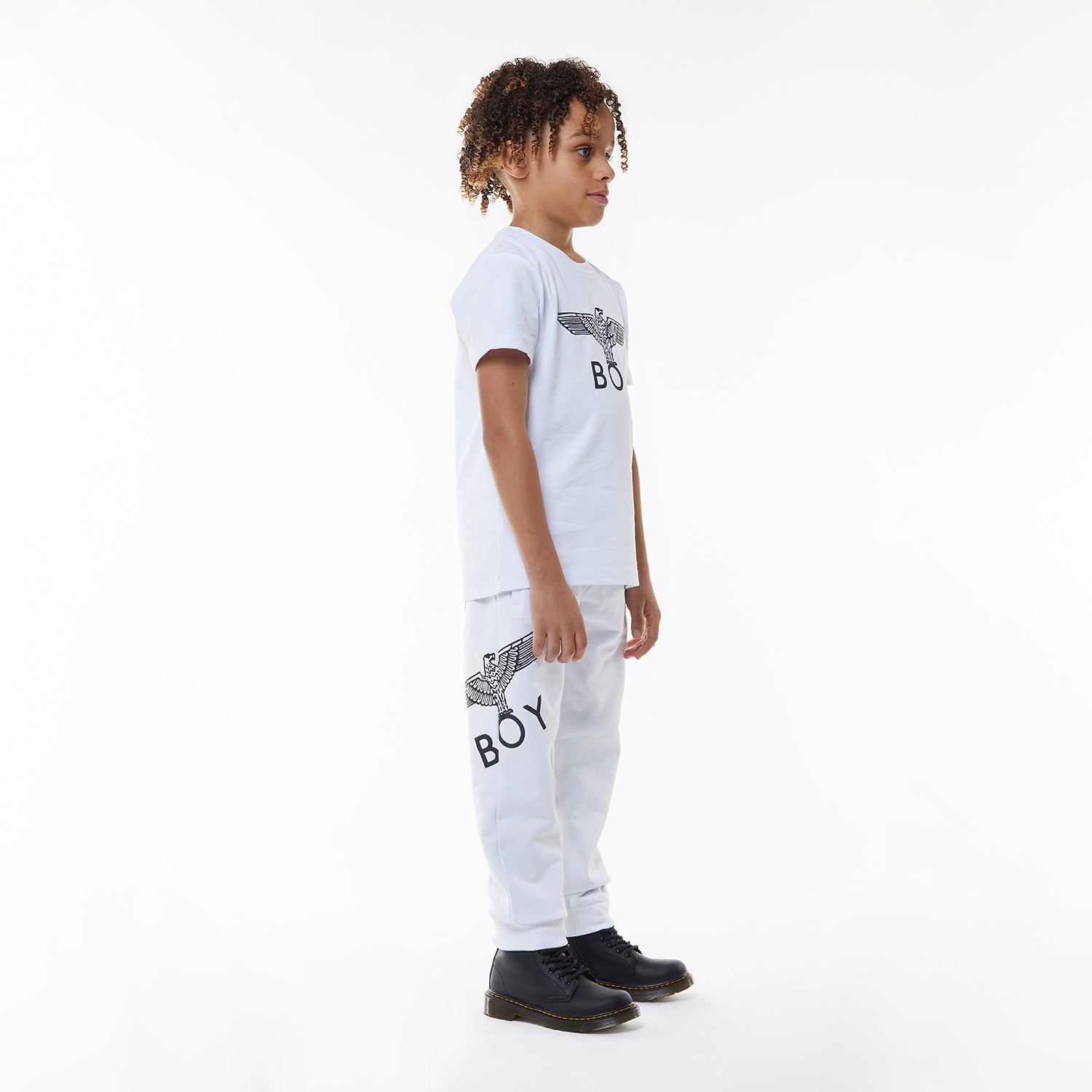 Model wearing White sweatpants with a logo on a white background