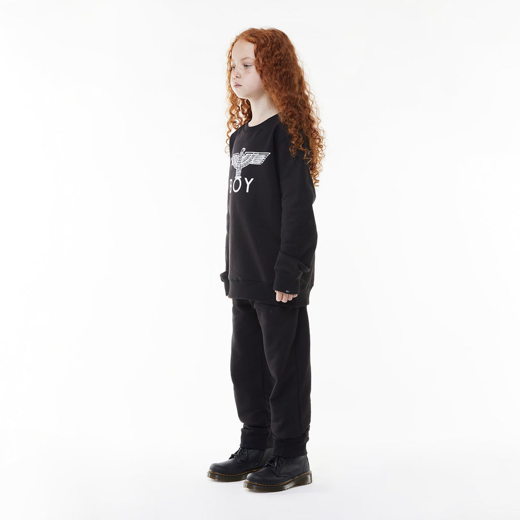 Model wearing BOY London sweatshirt on white background 