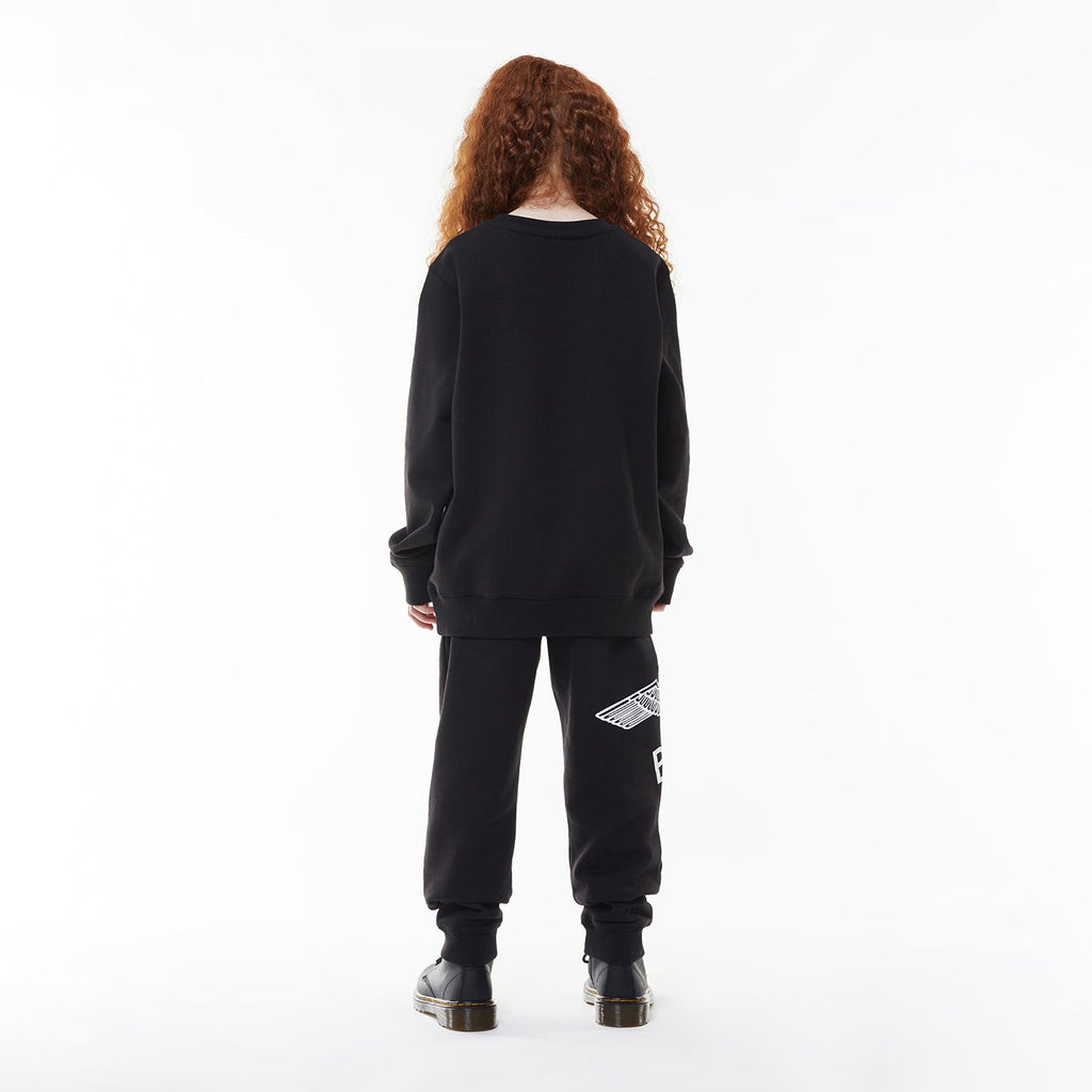 Model wearing BOY London sweatshirt on white background 