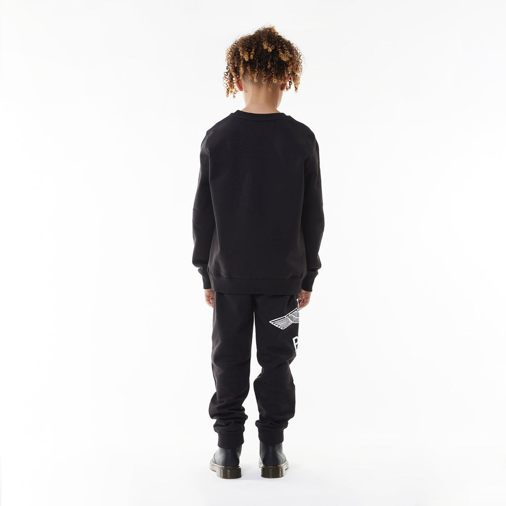 Model wearing BOY London sweatshirt on white background 