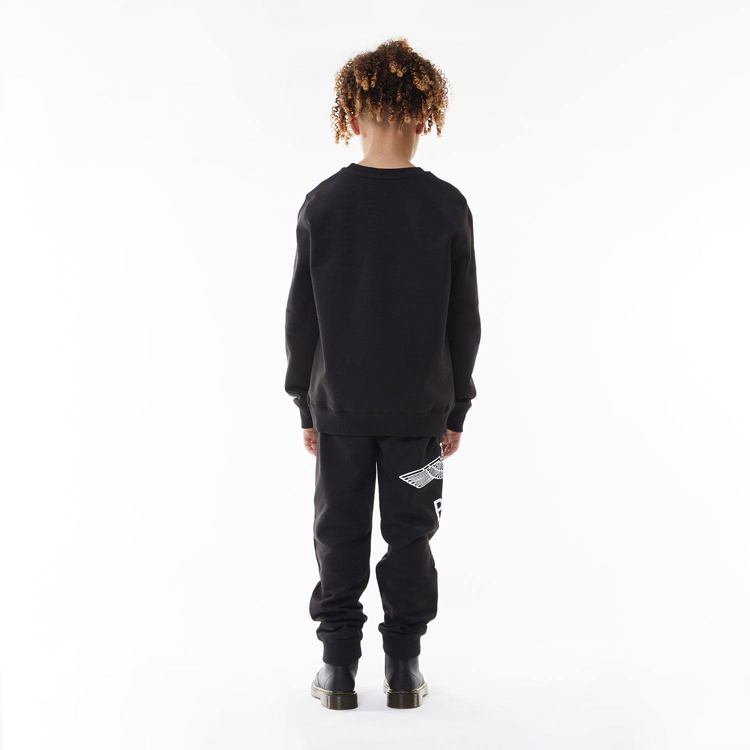 Model wearing BOY London sweatshirt on white background 