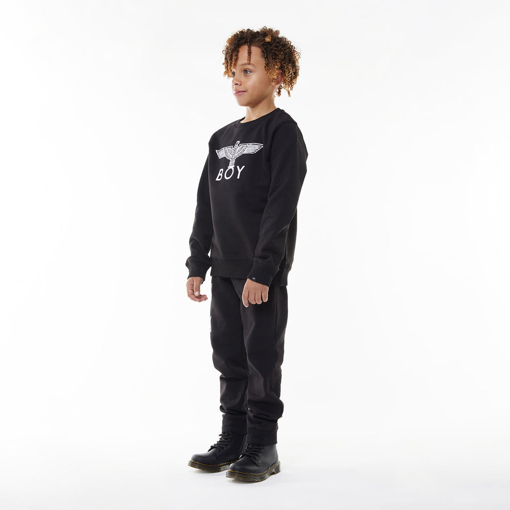 Model wearing BOY London sweatshirt on white background 