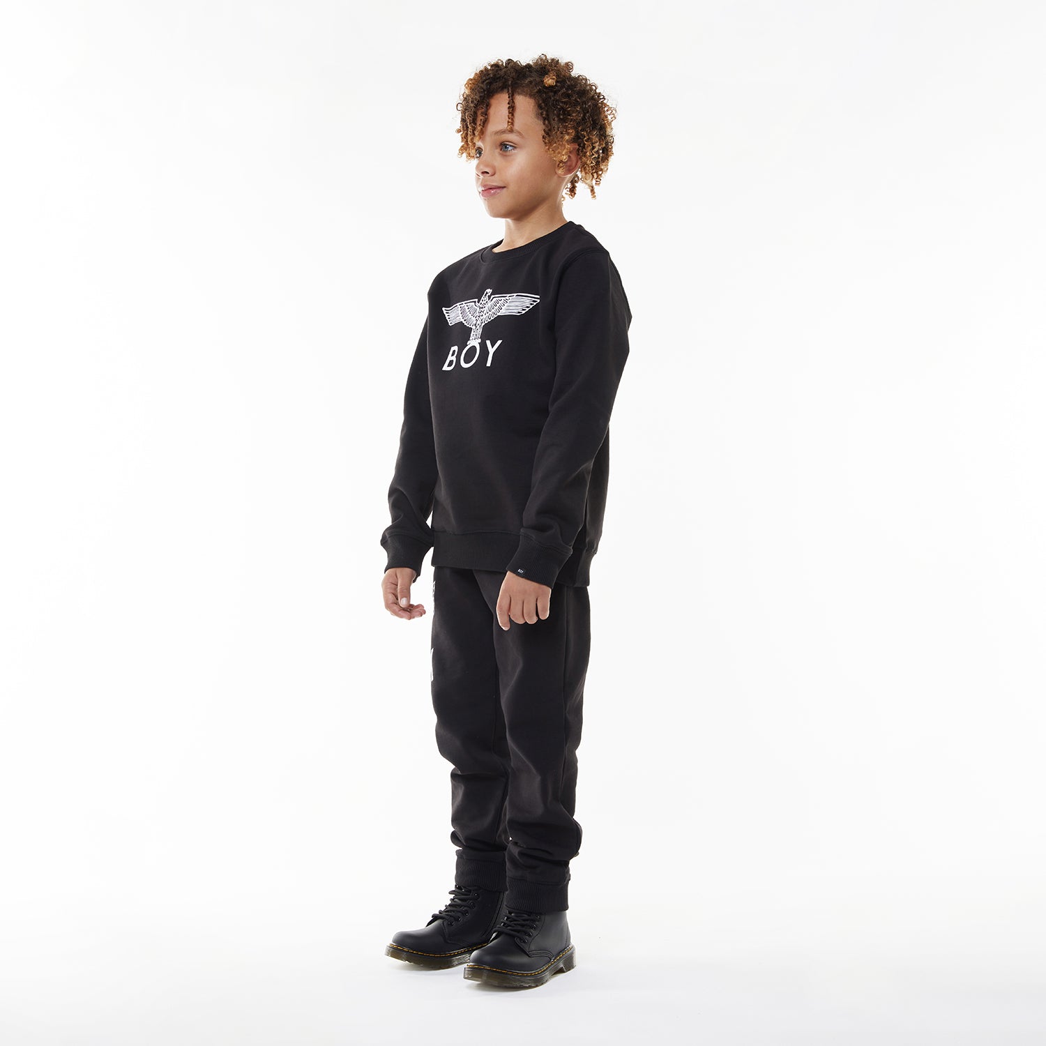 Model wearing BOY London sweatshirt on white background 