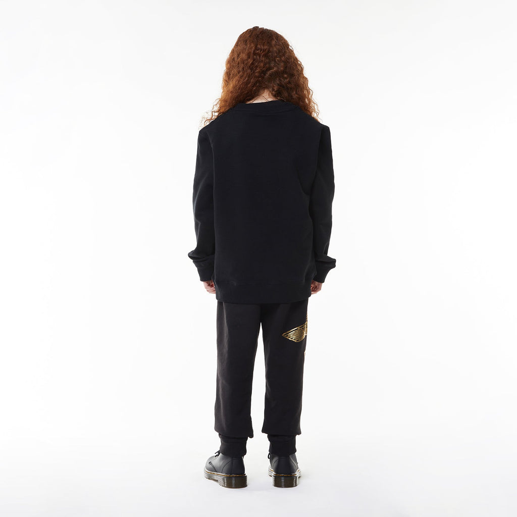 Model wearing Black sweatshirt with 'BOY' and eagle logo on a white background