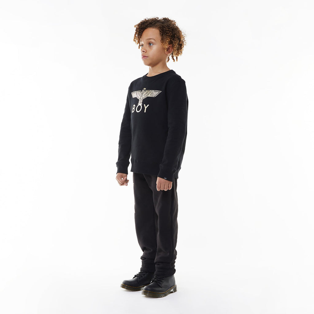 Model wearing Black sweatshirt with 'BOY' and eagle logo on a white background