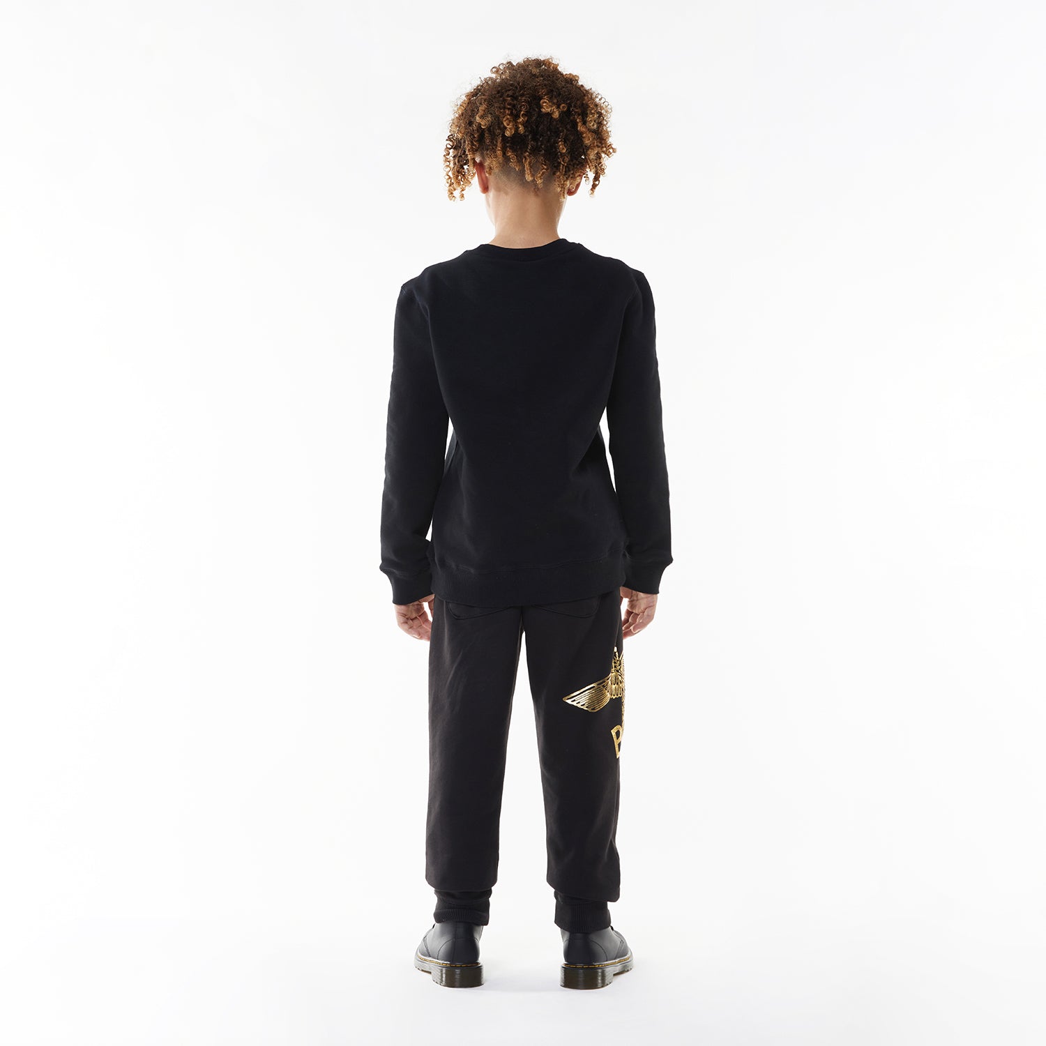 Model wearing Black sweatshirt with 'BOY' and eagle logo on a white background