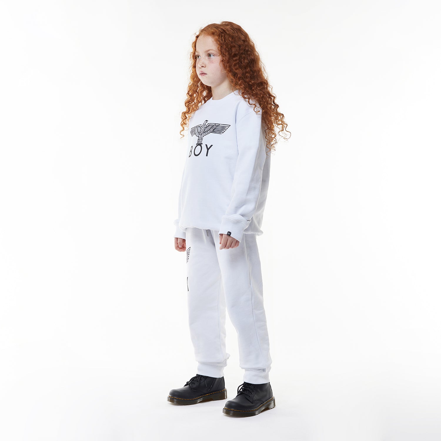 Model wearing White BOY London long-sleeve shirt with brand logo on a white background