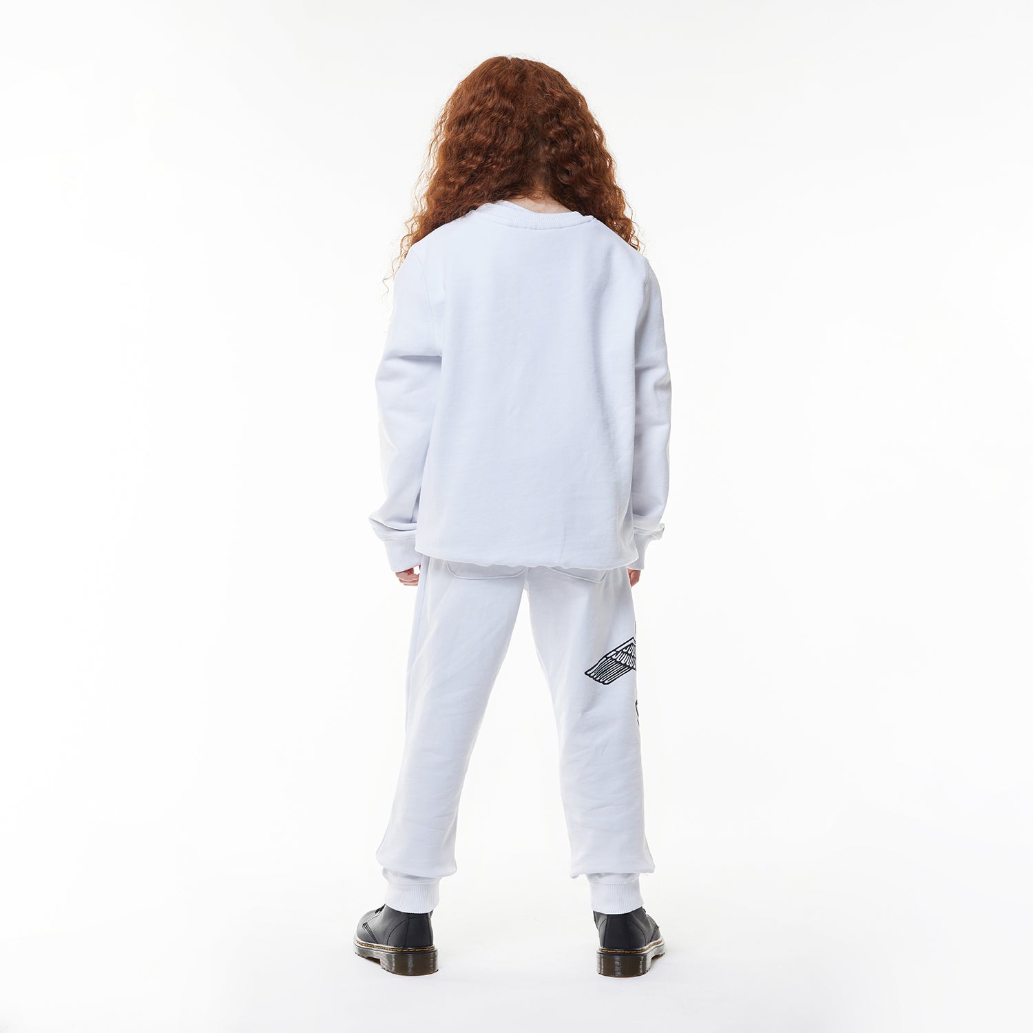 Model wearing White BOY London long-sleeve shirt with brand logo on a white background