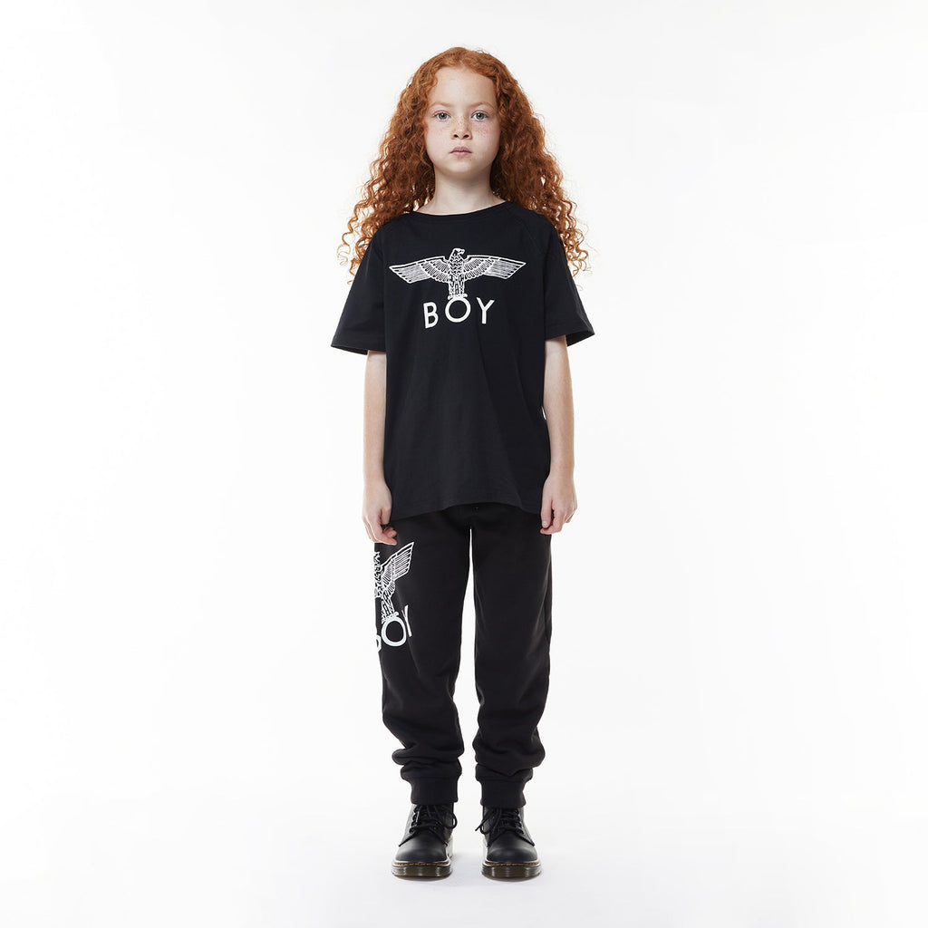 Model wearing Black t-shirt with 'BOY' logo on a white background