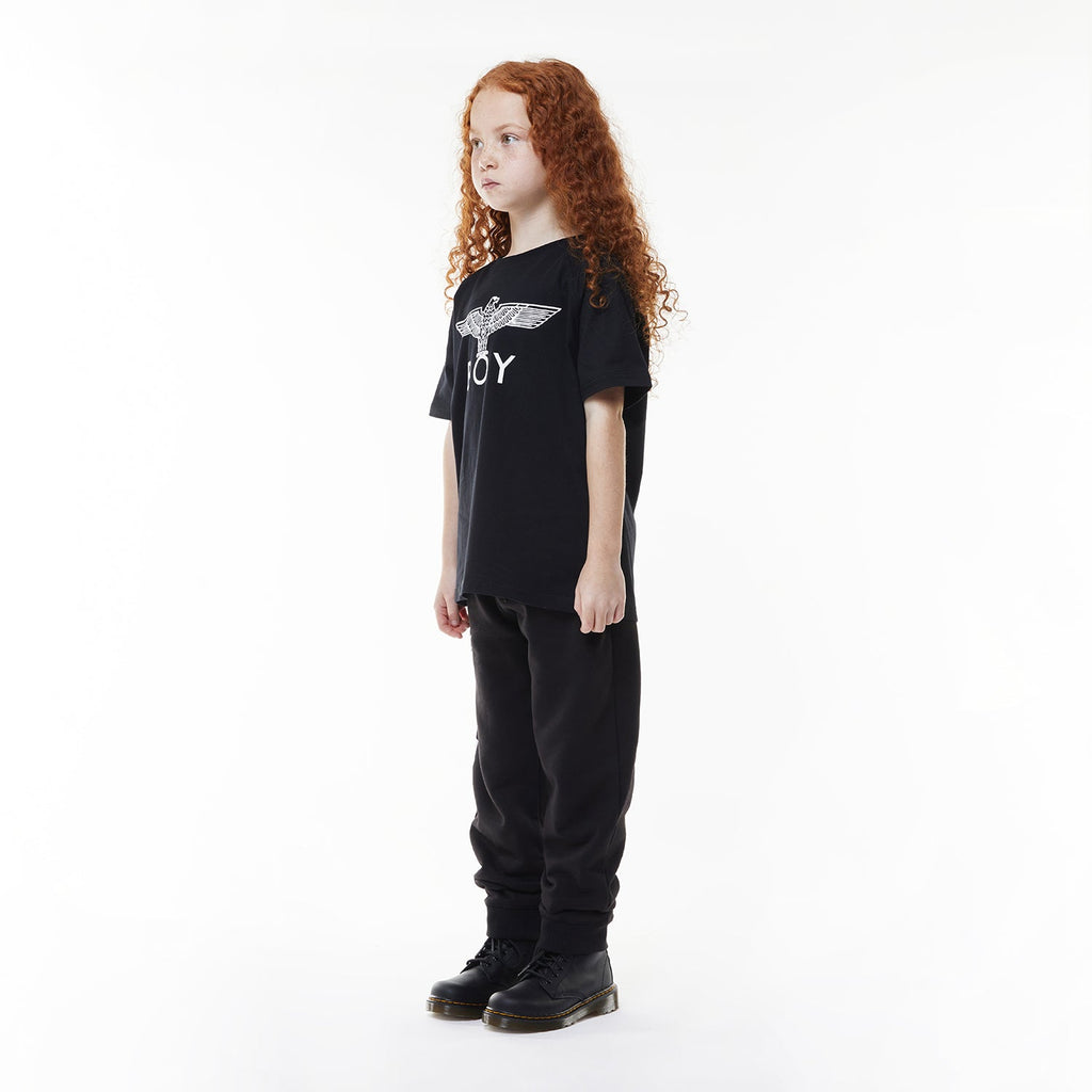 Model wearing Black t-shirt with 'BOY' logo on a white background