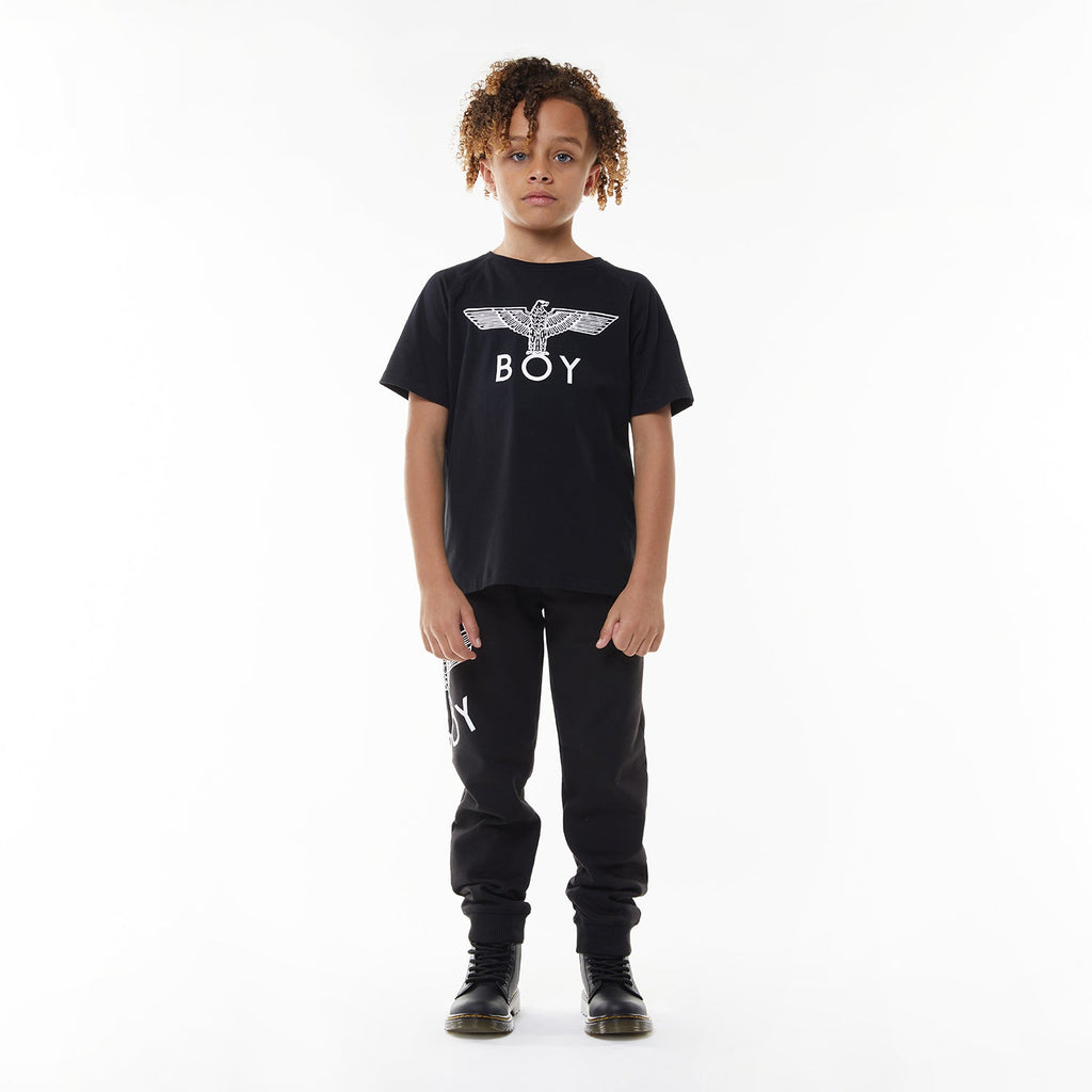Model wearing Black t-shirt with 'BOY' logo on a white background