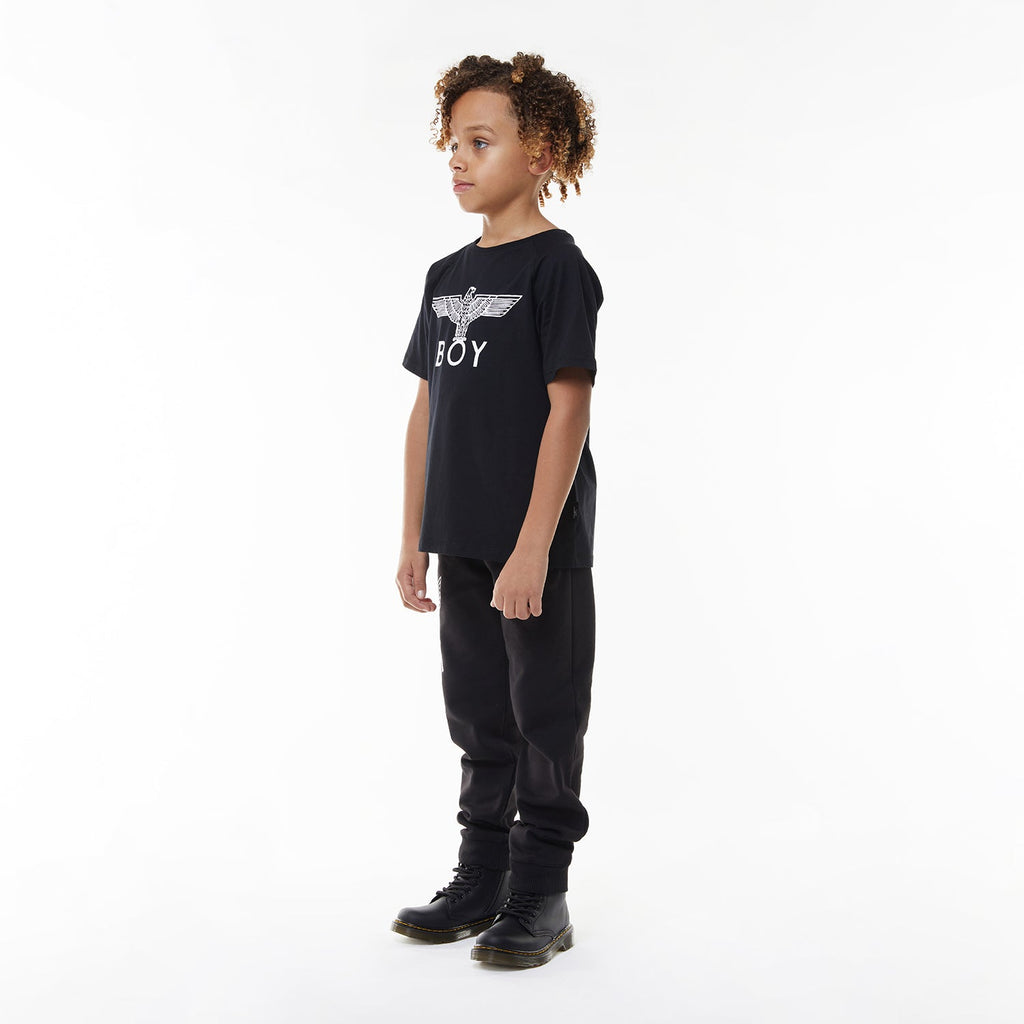 Model wearing Black t-shirt with 'BOY' logo on a white background