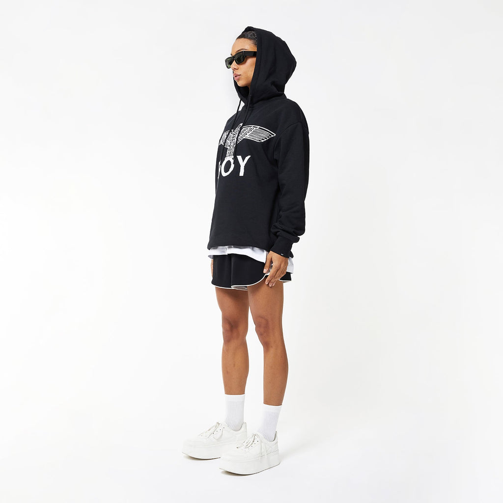 female model wearing Boy London Eagle hoodie on white background
