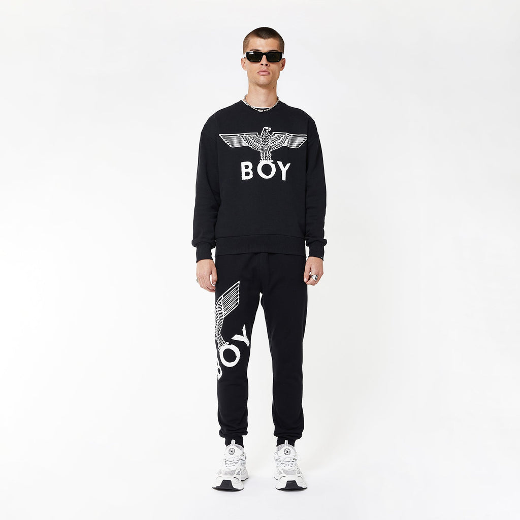 Model wearing boy london joggers on white background
