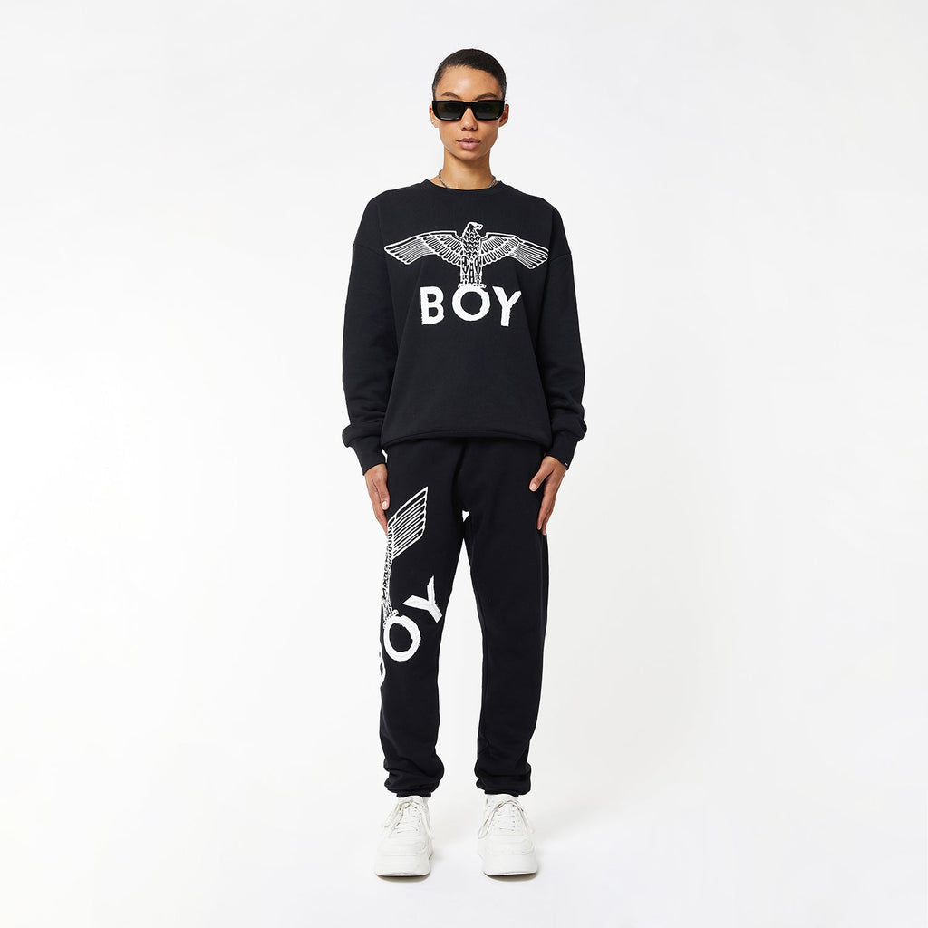Model wearing boy london joggers on white background
