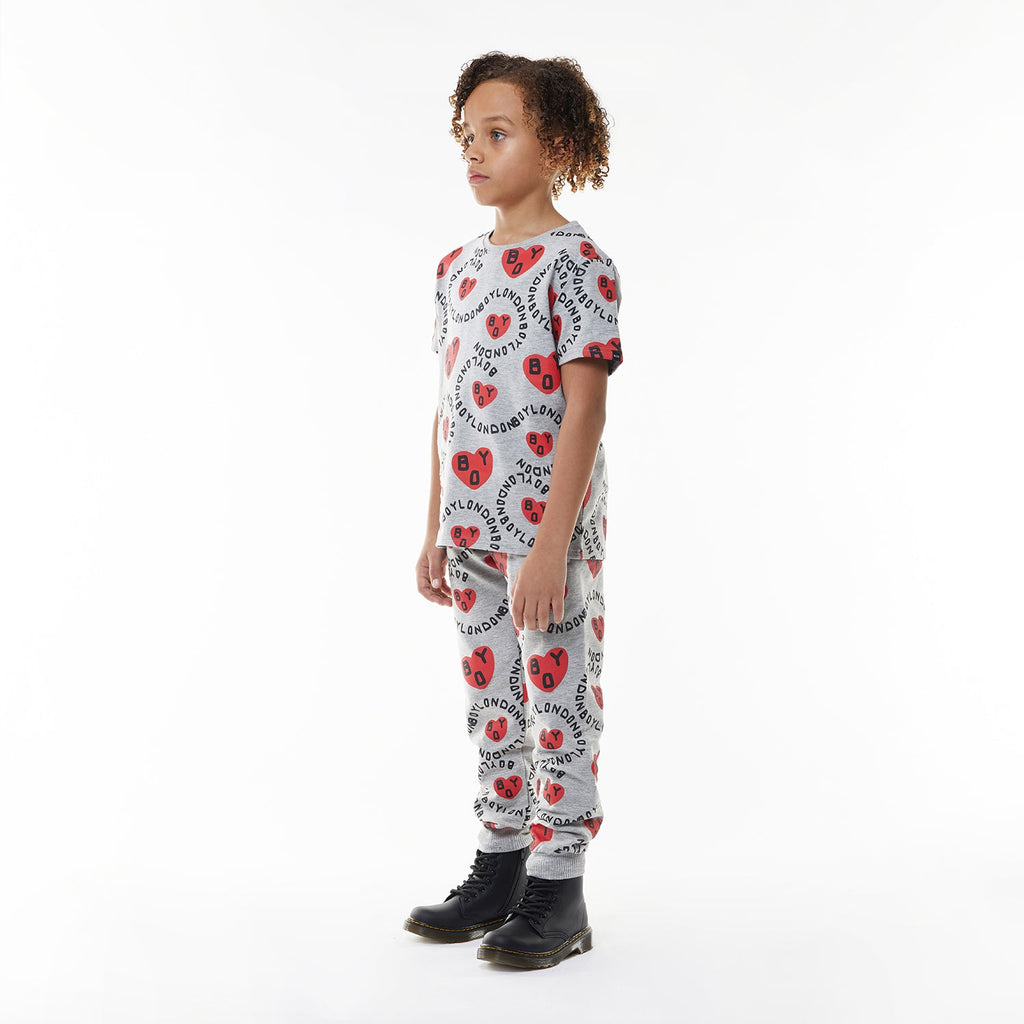 Model wearing BOY London kids joggers on white background