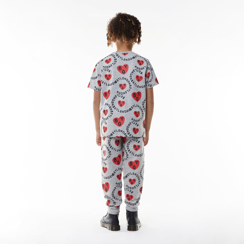 Model wearing BOY London kids joggers on white background