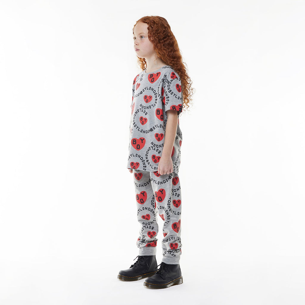 Model wearing BOY London kids joggers on white background