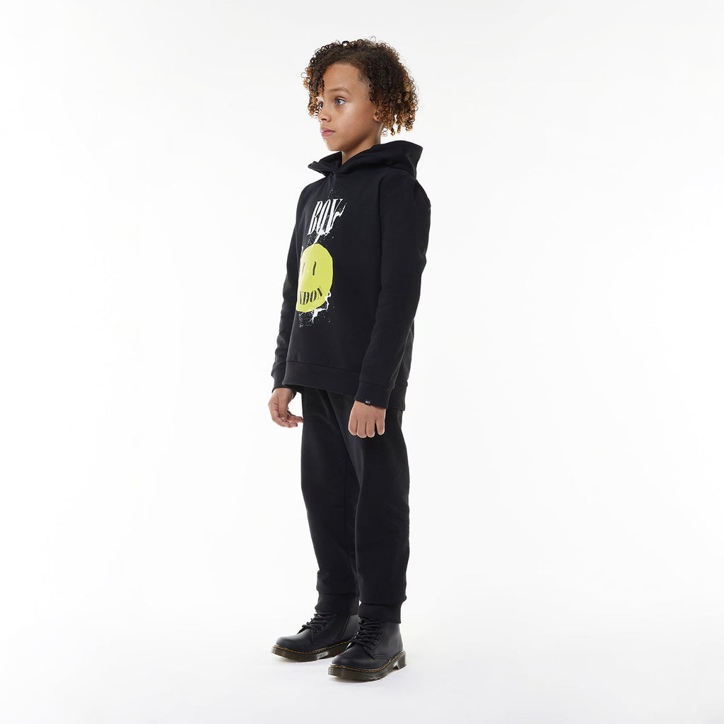 Model wearing BOY London hoodie on white background