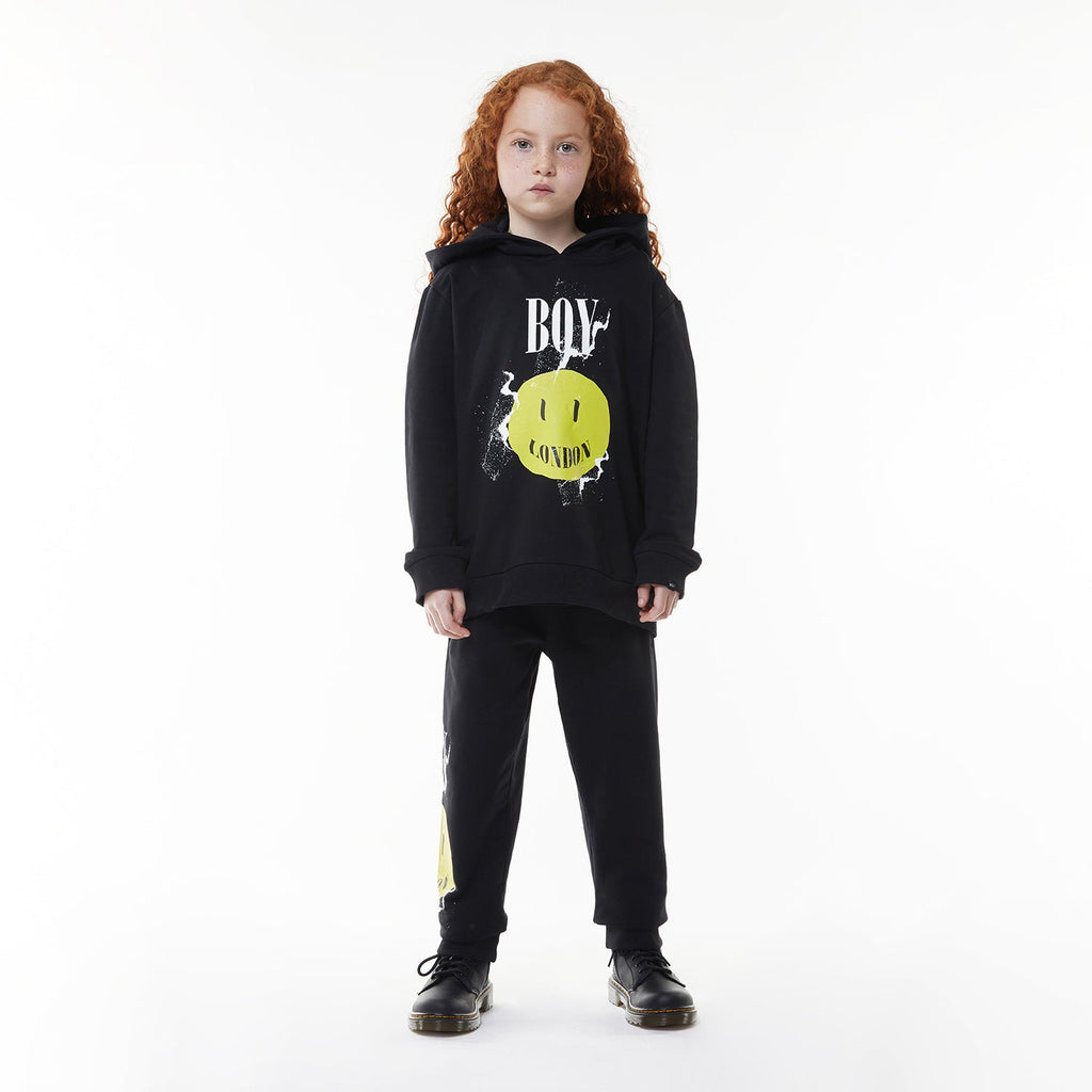 Model wearing BOY London hoodie on white background