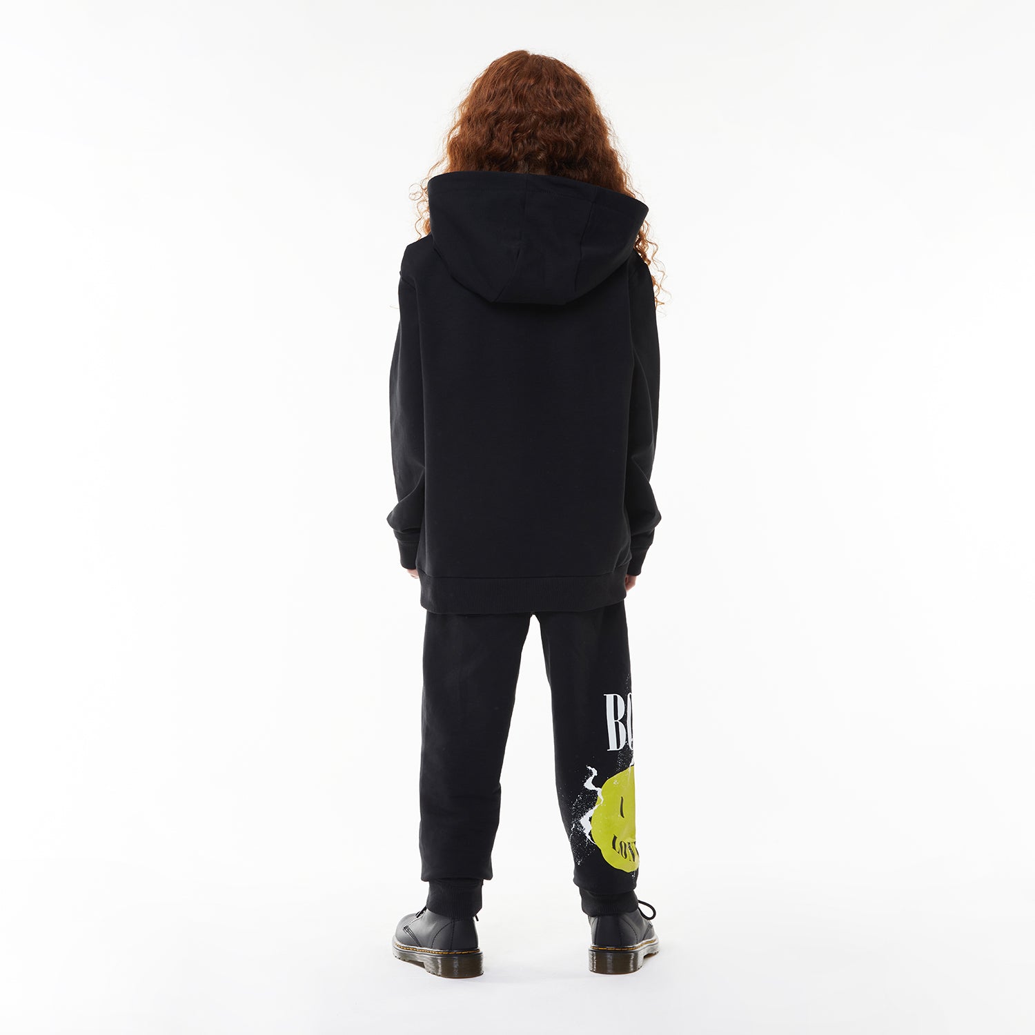 Model wearing BOY London hoodie on white background